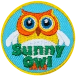 A yellow owl with white wings and a white belly with the words Sunny Owl at the bottom.