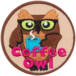 A brown owl with glasses holds a blue mug filled of hot coffee. The words Coffee Owl are across the bottom.