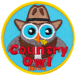 A grey owl wears a cowboy hat and a vest. The words Country Owl are across the bottom.