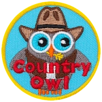 A grey owl wears a cowboy hat and a vest. The words Country Owl are across the bottom.