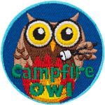 A brown owl roasts a marshmallow over a roaring campfire. The words, Campfire Owl are across the bottom.