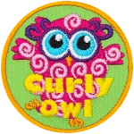 This pink owl has curls all over their body. The words Curly Owl are across the bottom.