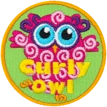 This pink owl has curls all over their body. The words Curly Owl are across the bottom.