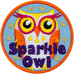 An orange, yellow and white owl with eyelashes and the words Sparkle Owl at the bottom.