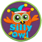 This orange owl wears a jester's hat as it fools around. The words Silly Owl are at the bottom.