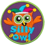 This orange owl wears a jester's hat as it fools around. The words Silly Owl are at the bottom.