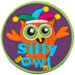 This orange owl wears a jester's hat as it fools around. The words Silly Owl are at the bottom.