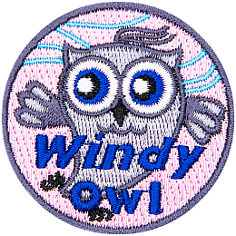 This grey owl dances in the wind. Whispy blue lines in the background indicate a breeze is blowing. The text Windy Owl is at the bottom.