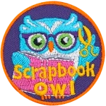 This circular patch shows a bespectacled owl holding scissors in one wing and a scrapbook in the other. The words Scrapbook Owl are at the bottom.