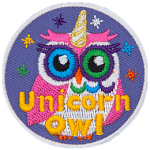 This circular badge displays a rainbow owl with a spiral horn on the top of its head and sparkles around it. The words Unicorn Owl rest at the bottom.