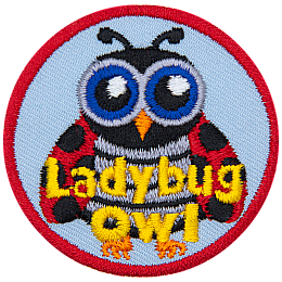 This owl is disguised as a ladybug. It has big blue eyes, antennae, and black-spotted red wings. The words Ladybug Owl are across the bottom.