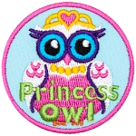 This regal princess owl wears a golden crown, necklace, and a beautiful pink dress.