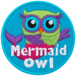 A green owl with a pink and purple mermaid tail swims gracefully through an ocean blue background. The text Mermaid Owl is at the bottom.
