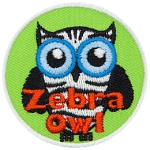 An owl striped like a Zebra. The words Zebra Owl are at the bottom.