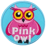 A pink owl with yellow eyes. The words Pink Owl are at the bottom.
