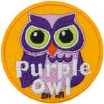 A purple owl with white accents. The words Purple Owl are at the bottom.