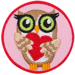 A brown owl holding a red heart.