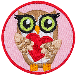 A brown owl holding a red heart.