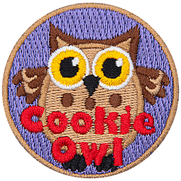 A fat brown owl with wide yellow eyes. The words Cookie Owl are stitched below.