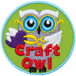 A white owl holding scissors and a paper heart. The words Craft Owl are at the bottom.