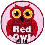 A red owl with yellow eyes. The words Red Owl are at the bottom.