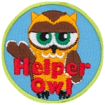 A cream and brown owl with half-lidded eyes with its wing stretched out. The words Helper Owl are across the bottom.