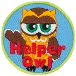 A cream and brown owl with half-lidded eyes with its wing stretched out. The words Helper Owl are across the bottom.