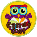 A purple owl with a swirled candy for its stomach. The words Candy Owl are at the bottom.