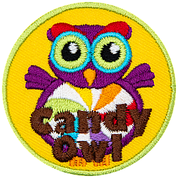 A purple owl with a swirled candy for its stomach. The words Candy Owl are at the bottom.