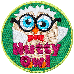 A cream and white owl with glasses and a red bowtie. The words Nutty owl are across the bottom.