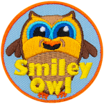 A brown owl with a big smile. The words Smiley Owl are across the bottom.