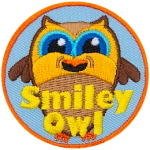 A brown owl with a big smile. The words Smiley Owl are across the bottom.