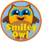 A brown owl with a big smile. The words Smiley Owl are across the bottom.