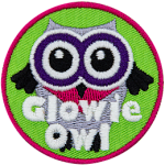 A white owl with black wings and purple eyes. The words Glowie Owl are across the bottom.