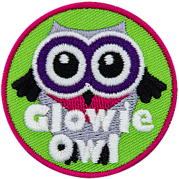 A white owl with black wings and purple eyes. The words Glowie Owl are across the bottom.