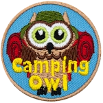 A brown owl with a red sleeping bag and a green bucket hat. The words Camping Owl are across the bottom.