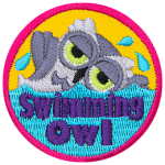 A white owl swimming in water. The words Swimming Owl are in the water.