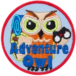 A light brown owl with a backpack and binoculars. The words Adventure Owl are across the bottom. 