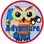 A light brown owl with a backpack and binoculars. The words Adventure Owl are across the bottom. 