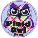 A purple, green and red plaid owl with bushy eyebrows. The words Plaid Owl are across the bottom.