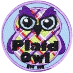 A purple, green and red plaid owl with bushy eyebrows. The words Plaid Owl are across the bottom.
