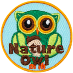 A green owl made from leaves. The words Nature Owl are across the bottom.