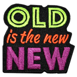 The words Old is the new New are stacked on top of each other and embroidered in neon colours.