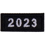 This 1-inch wide by 0.5-inches high rocker forms a straight-edged rectangle. The year number 2023 is embroidered in a bold font.