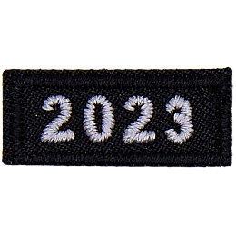 This 1-inch wide by 0.5-inches high rocker forms a straight-edged rectangle. The year number 2023 is embroidered in a bold font.