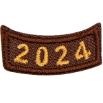 This brown rocker curves upwards like a smile. The year number 2024 is embroidered in a bold font.