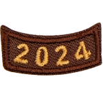 This brown rocker curves upwards like a smile. The year number 2024 is embroidered in a bold font.
