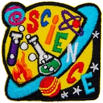 A yellow and blue Saturn with beakers on it. The word Science is stitched across the planet.