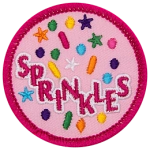 Multicoloured sprinkle shapes fall around the word Sprinkles.