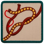 This square badge displays step two on how to make a square knot. Now cross the right side over the left and wrap around the other.
